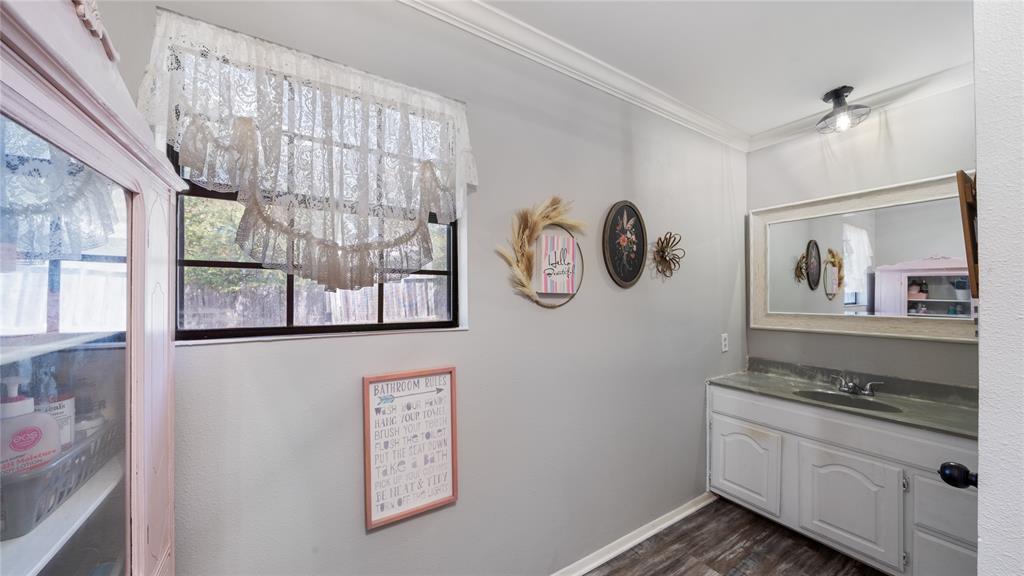 14260 North 3rd Street Scurry, TX 75158 - Photo 9 of 13 a kitchen with stainless steel appliances granite countertop a stove and a window