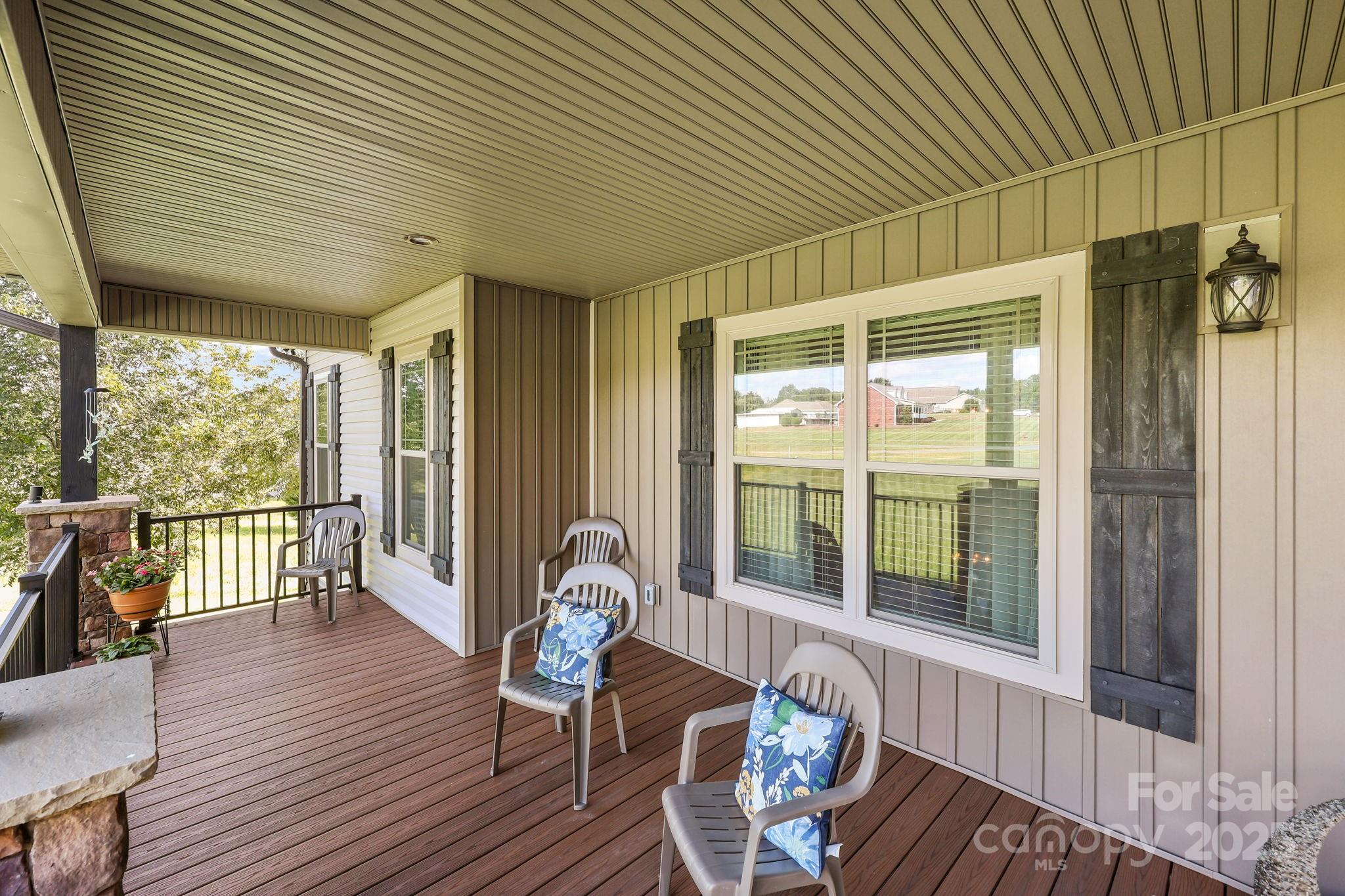 27040 Crepts Branch Road Locust, NC 28097 - Photo 11 of 48 a view of a patio with wooden floor