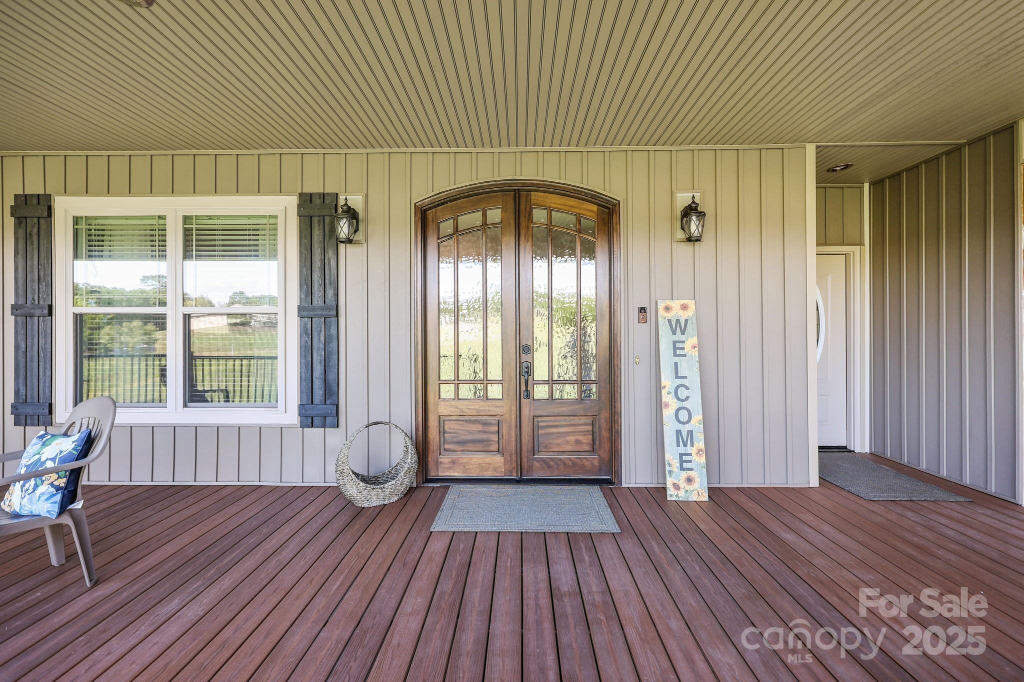 27040 Crepts Branch Road Locust, NC 28097 - Photo 12 of 48 a view of empty room with wooden floor and fan
