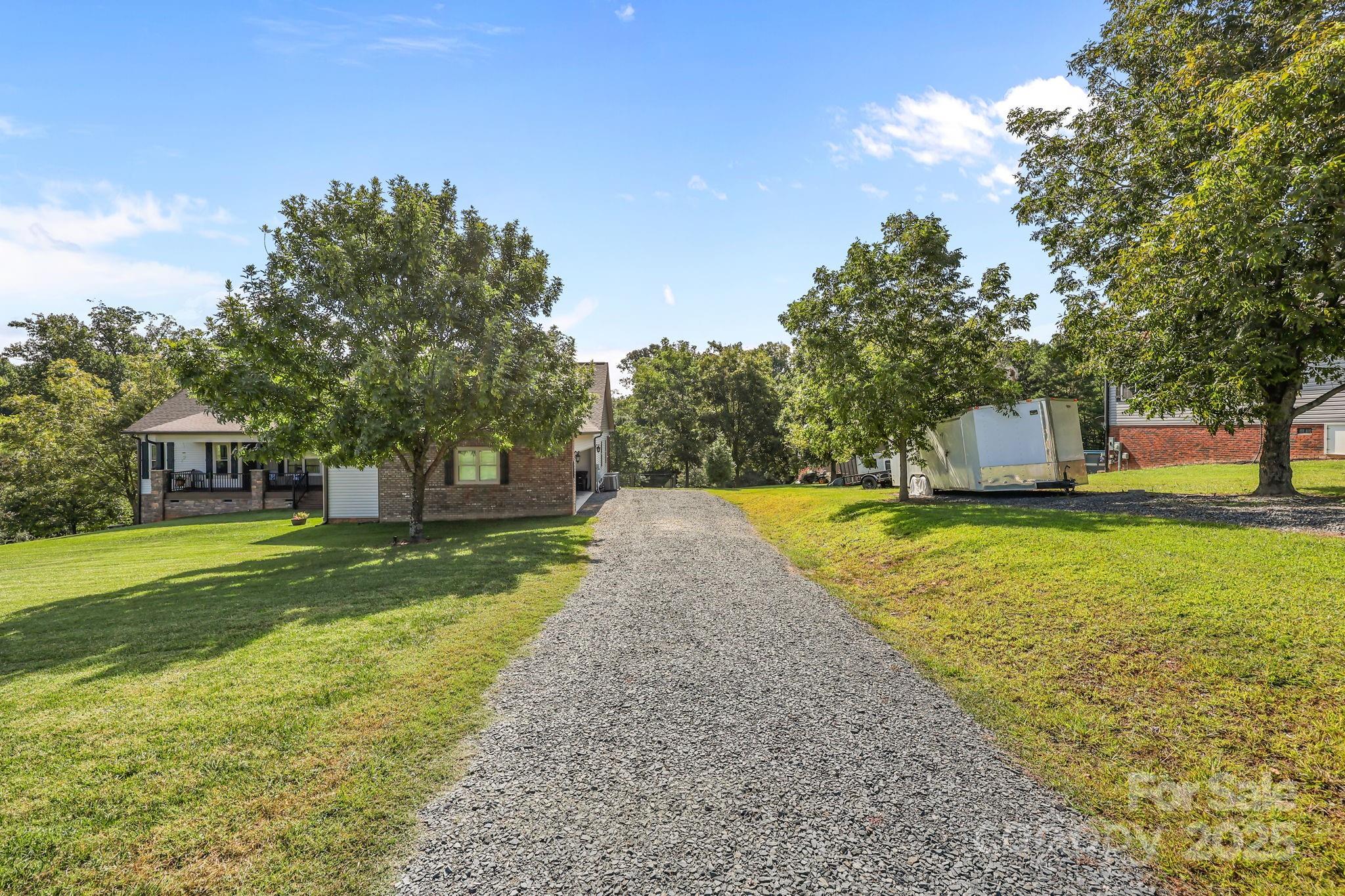 27040 Crepts Branch Road Locust, NC 28097 - Photo 16 of 48 a view of a house with a yard