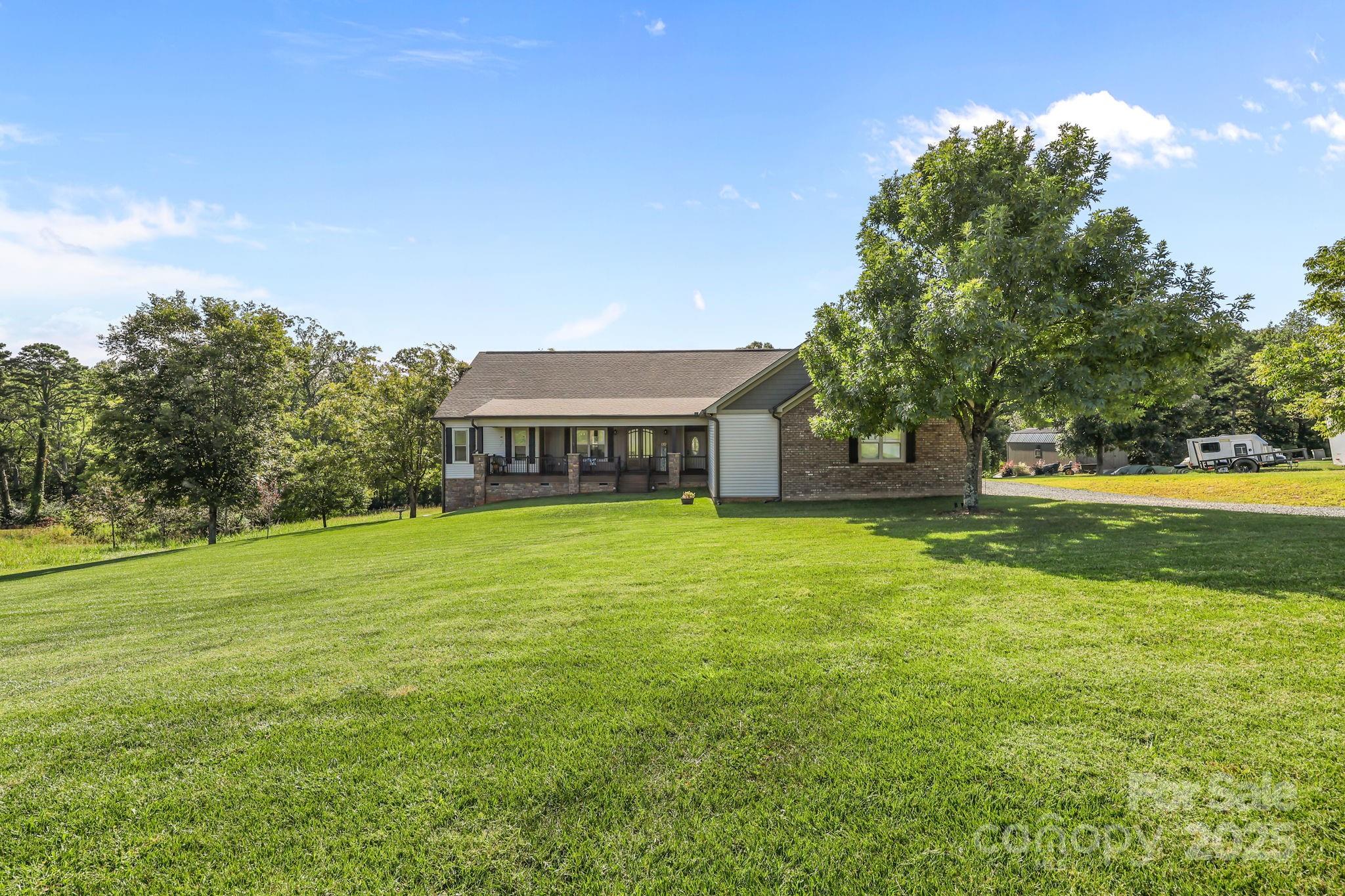 27040 Crepts Branch Road Locust, NC 28097 - Photo 17 of 48 a front view of a house with a yard