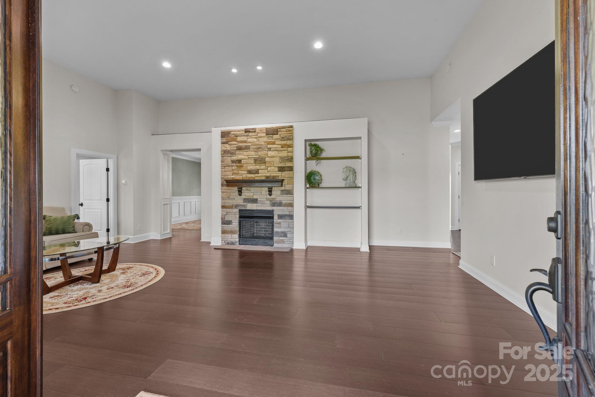 27040 Crepts Branch Road Locust, NC 28097 - Photo 18 of 48 an empty room with wooden floor and windows