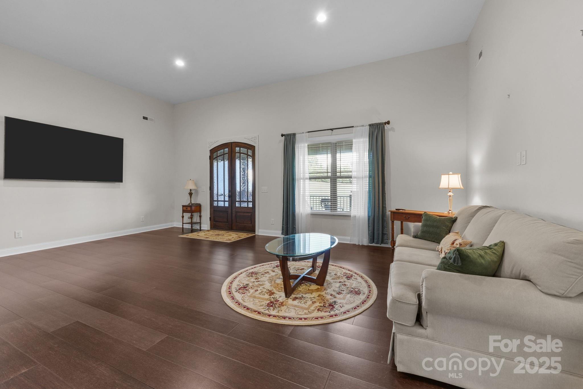27040 Crepts Branch Road Locust, NC 28097 - Photo 20 of 48 a living room with furniture and a flat screen tv