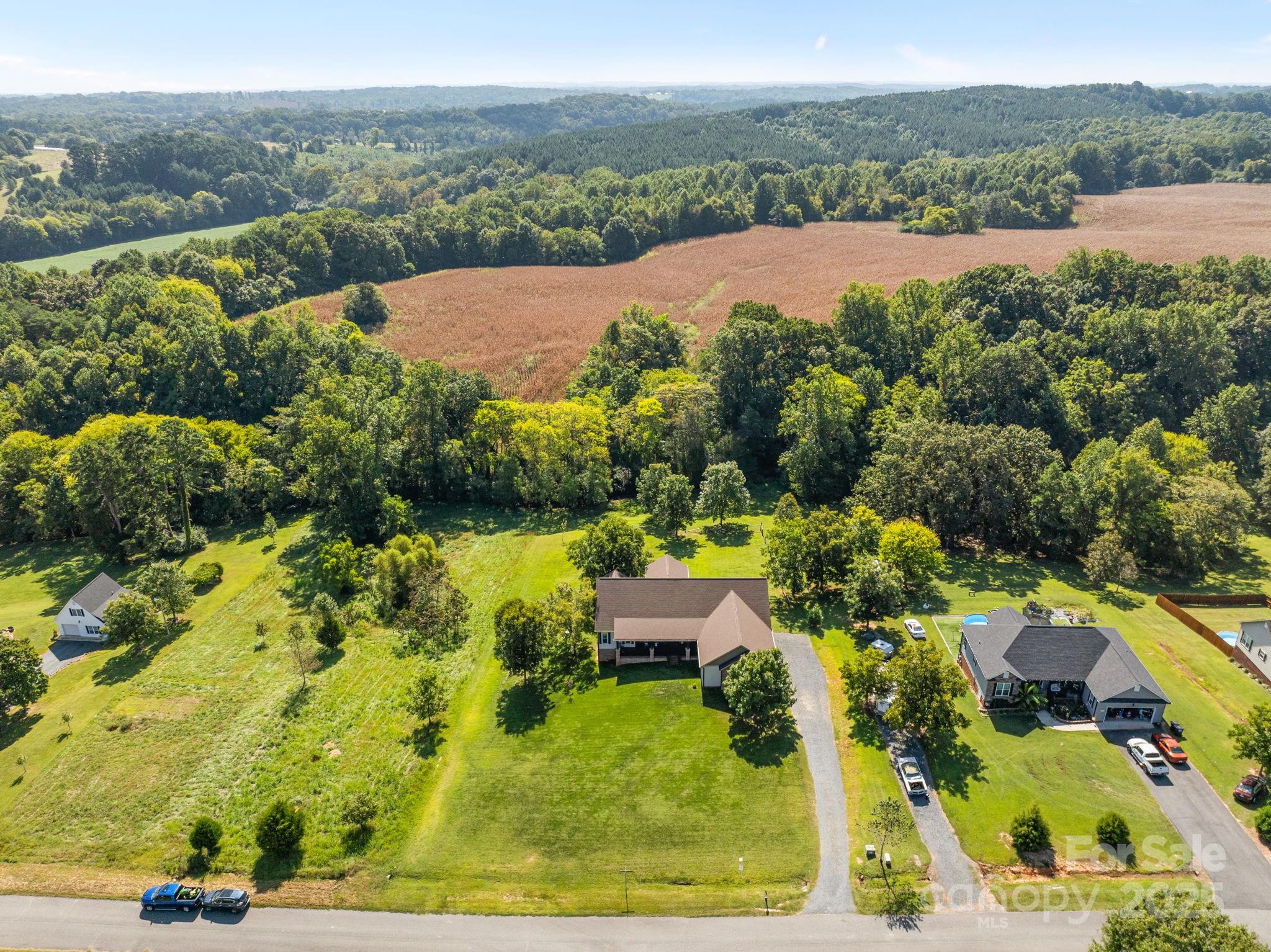 27040 Crepts Branch Road Locust, NC 28097 - Photo 2 of 48 an aerial view of a house with a garden
