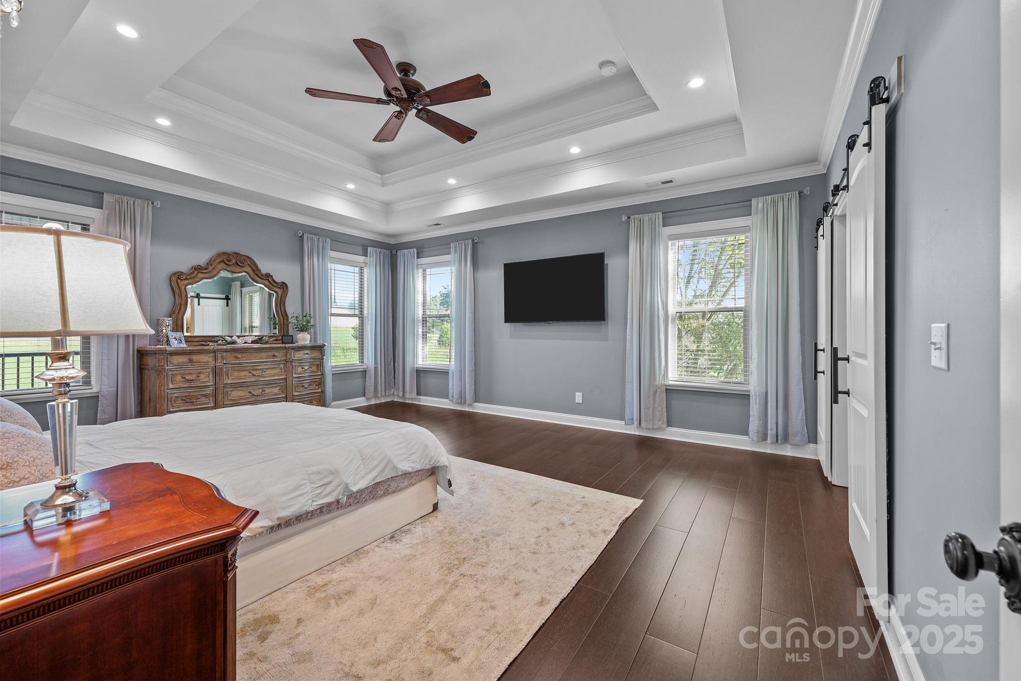 27040 Crepts Branch Road Locust, NC 28097 - Photo 22 of 48 a living room with furniture and a flat screen tv
