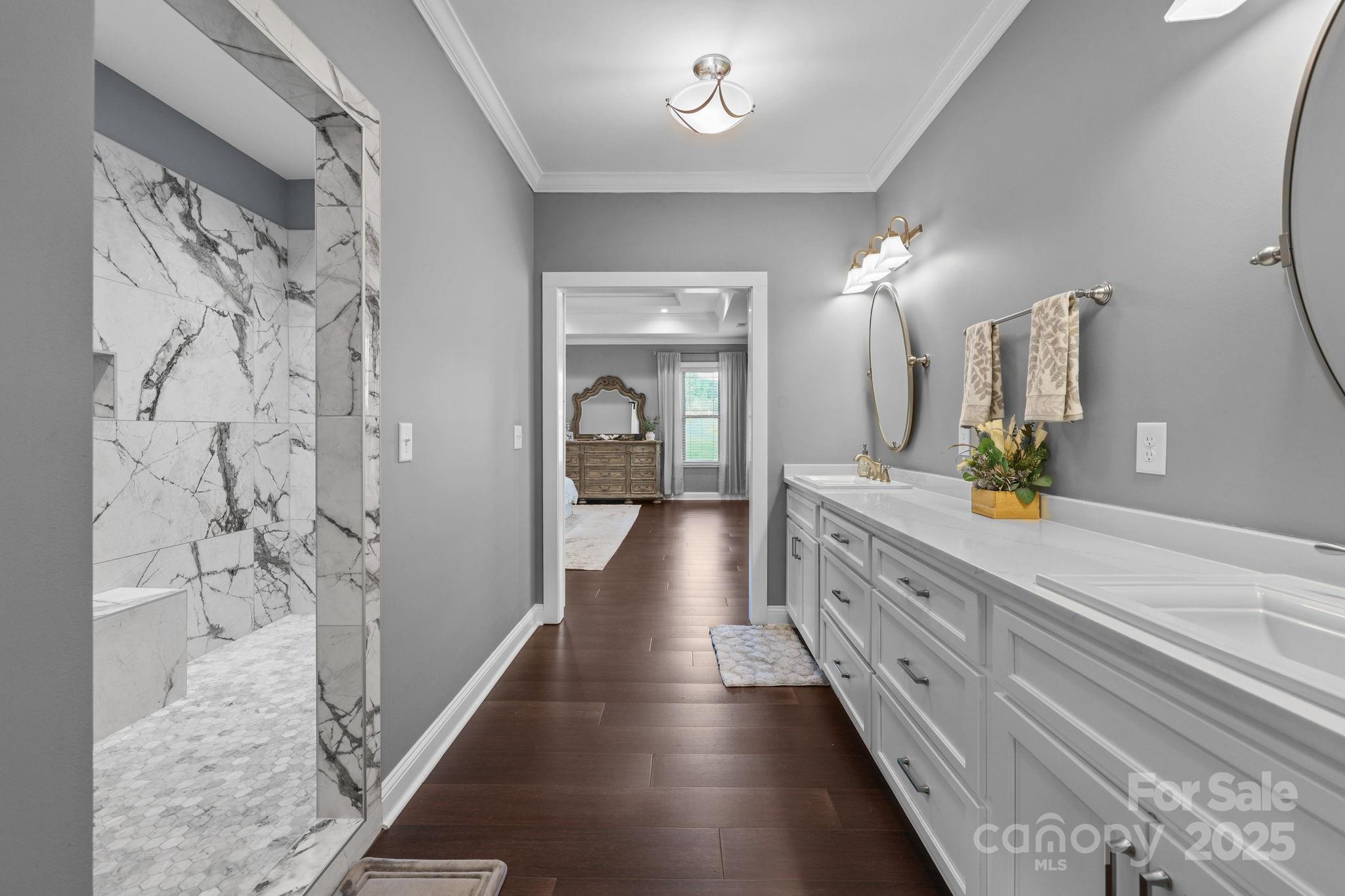 27040 Crepts Branch Road Locust, NC 28097 - Photo 27 of 48 a bathroom with a double vanity sink and a mirror