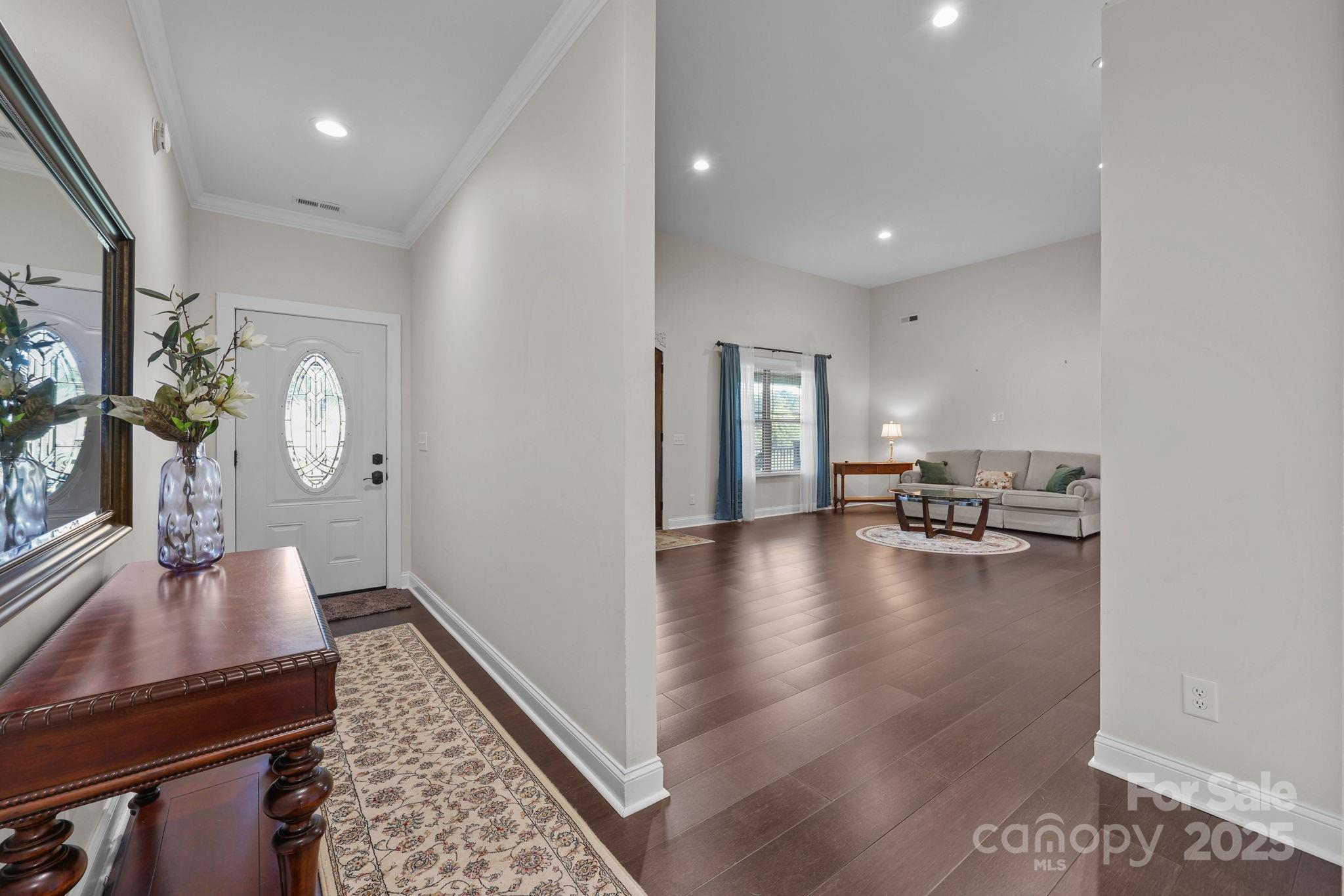 27040 Crepts Branch Road Locust, NC 28097 - Photo 29 of 48 a living room with fireplace furniture and a wooden floor