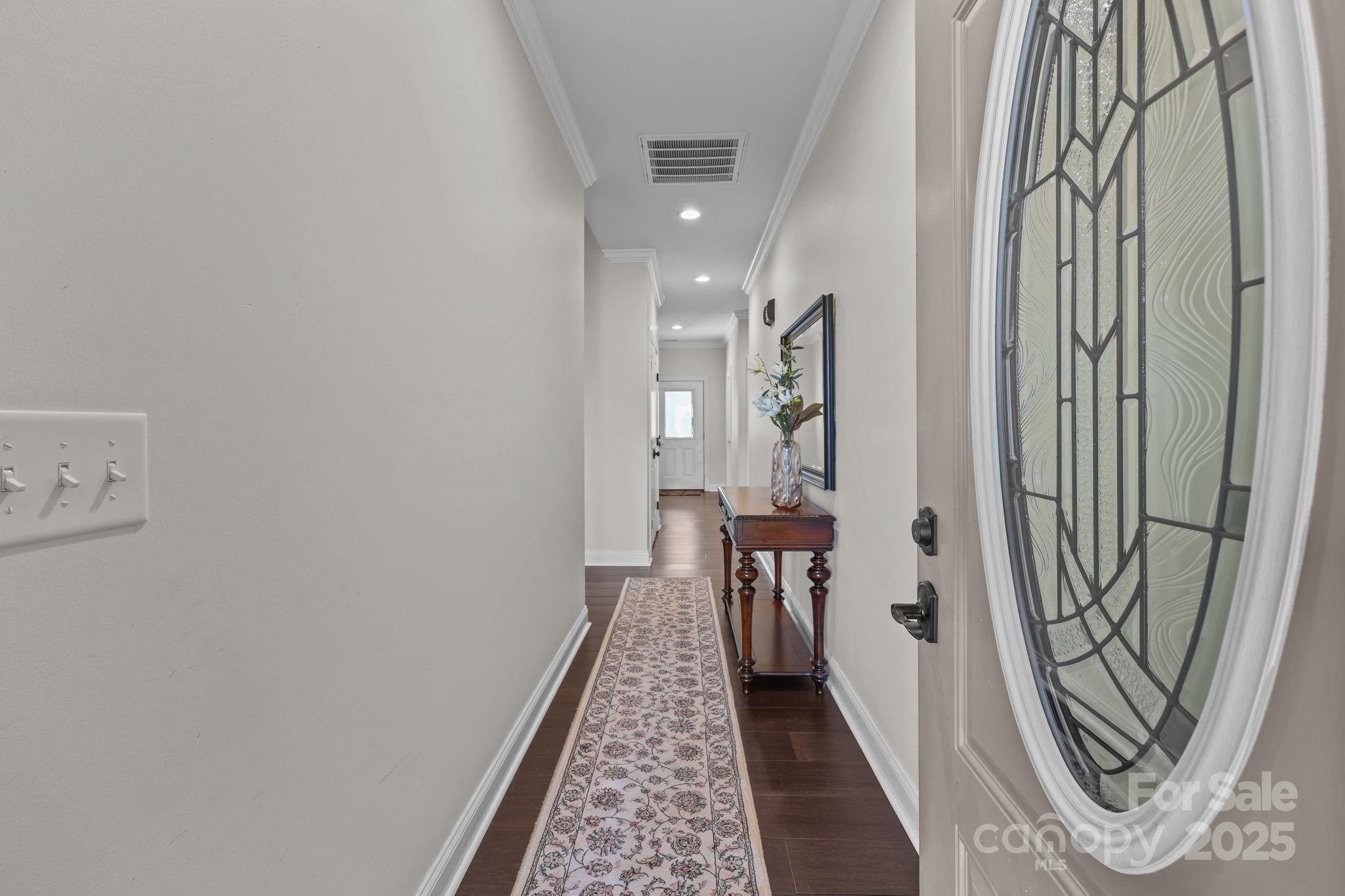 27040 Crepts Branch Road Locust, NC 28097 - Photo 30 of 48 a view of a hallway with wooden floor and staircase