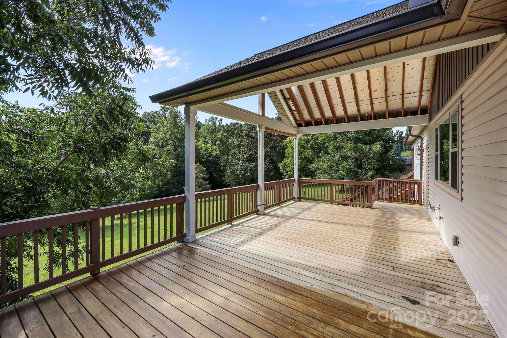 27040 Crepts Branch Road Locust, NC 28097 - Photo 3 of 48 a view of balcony with wooden floor and fence