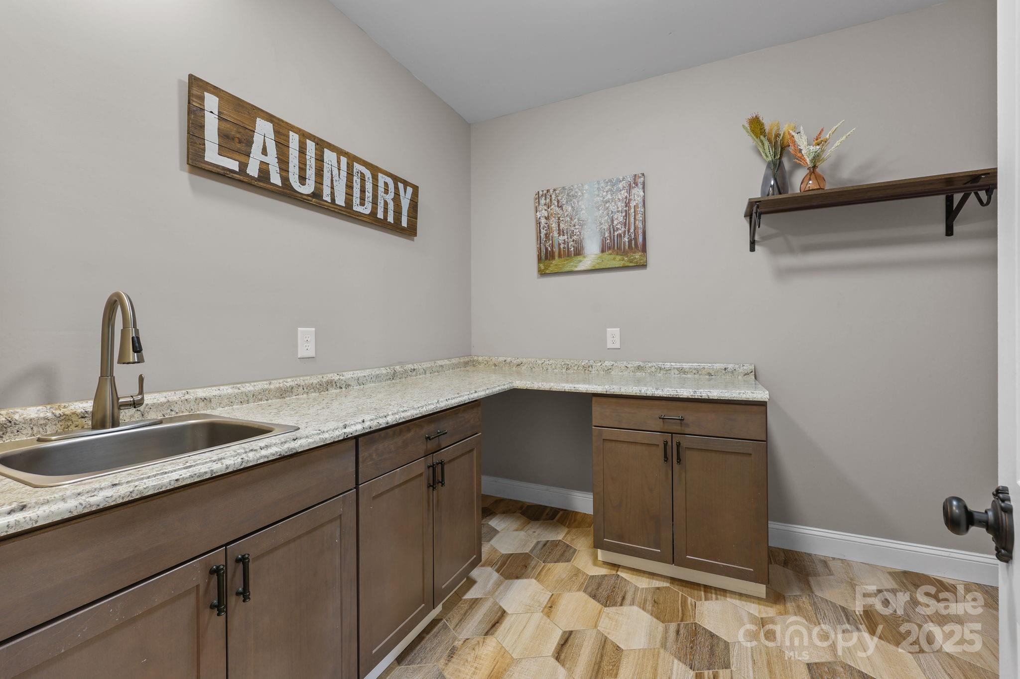 27040 Crepts Branch Road Locust, NC 28097 - Photo 32 of 48 a kitchen with a sink and cabinets