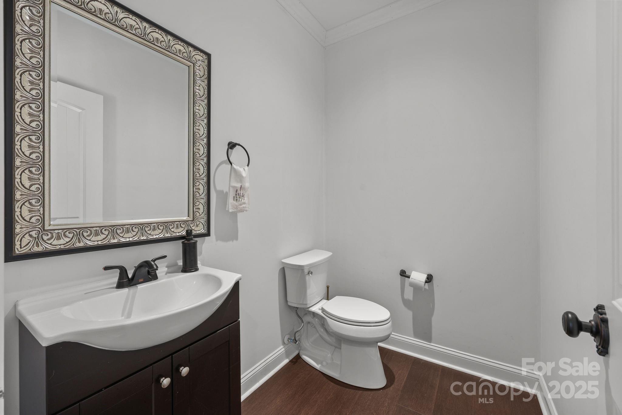 27040 Crepts Branch Road Locust, NC 28097 - Photo 38 of 48 a bathroom with a toilet sink and mirror