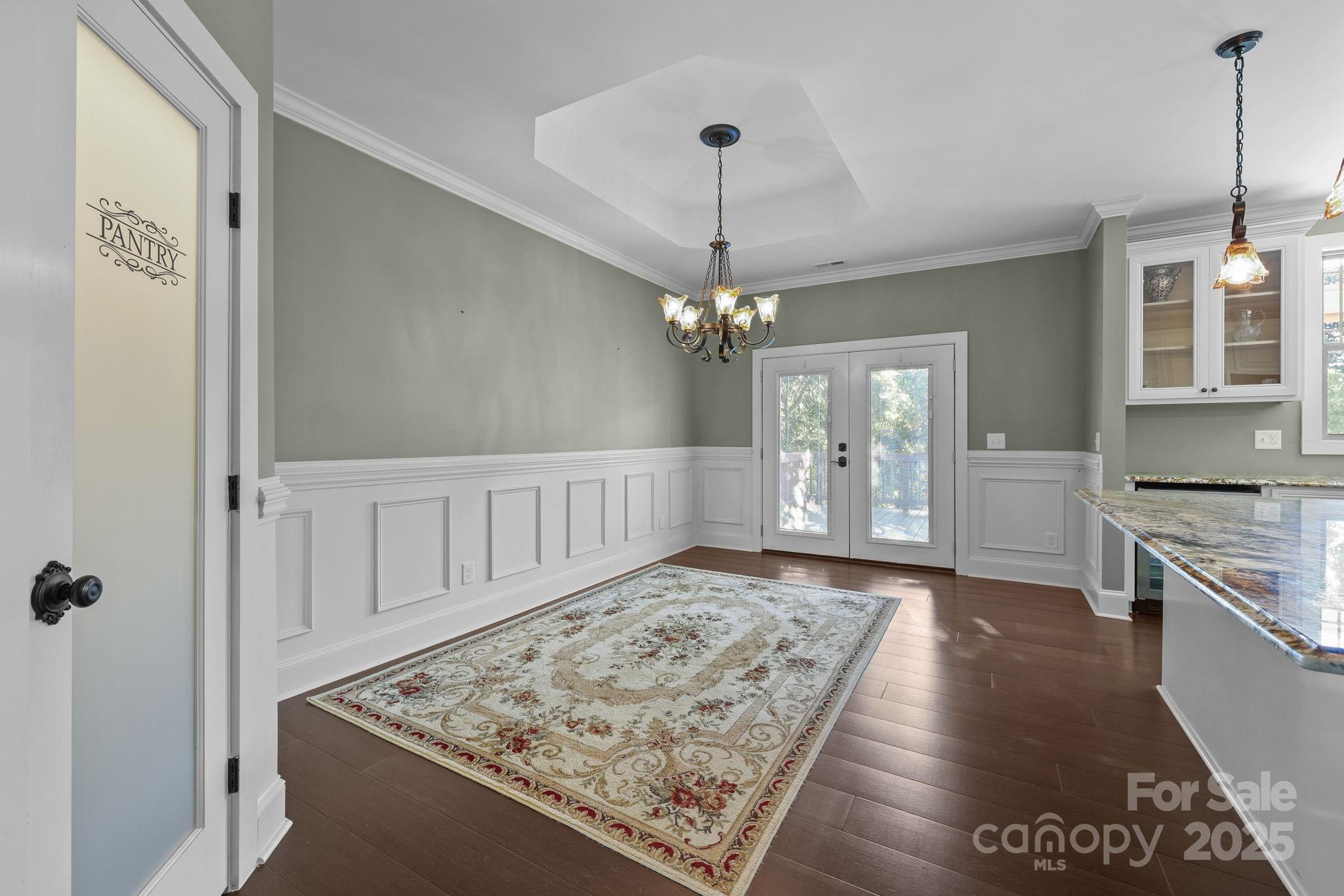 27040 Crepts Branch Road Locust, NC 28097 - Photo 40 of 48 a view of a hallway with wooden floor and a living room
