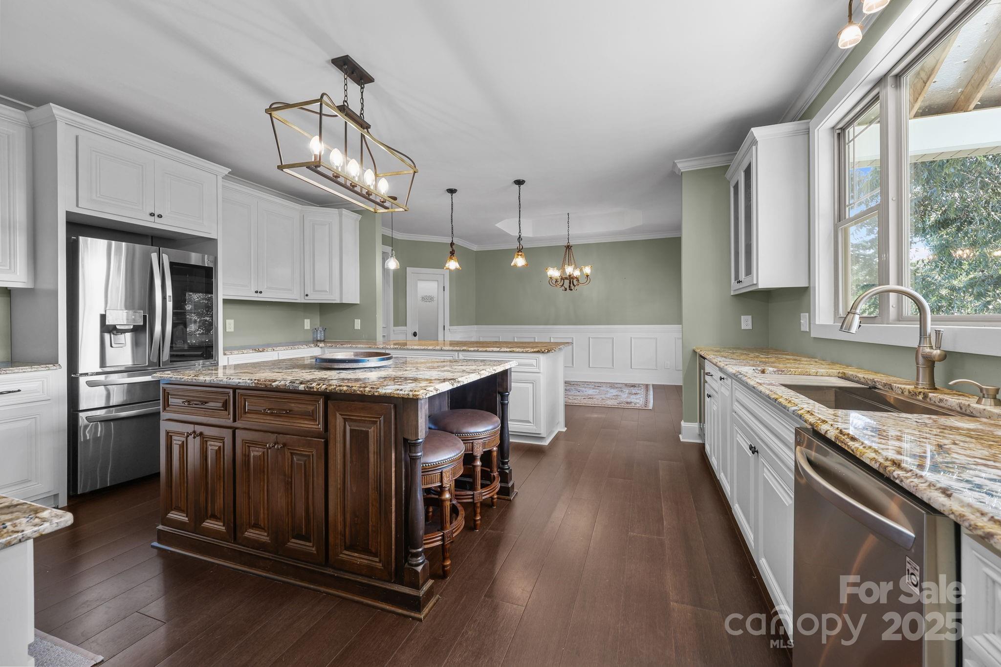 27040 Crepts Branch Road Locust, NC 28097 - Photo 46 of 48 a kitchen with stainless steel appliances granite countertop a sink stove and refrigerator