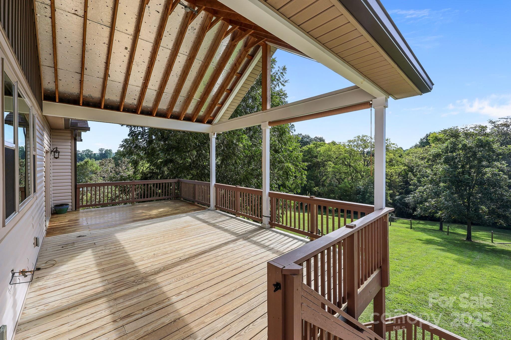 27040 Crepts Branch Road Locust, NC 28097 - Photo 5 of 48 a view of backyard with green space and deck