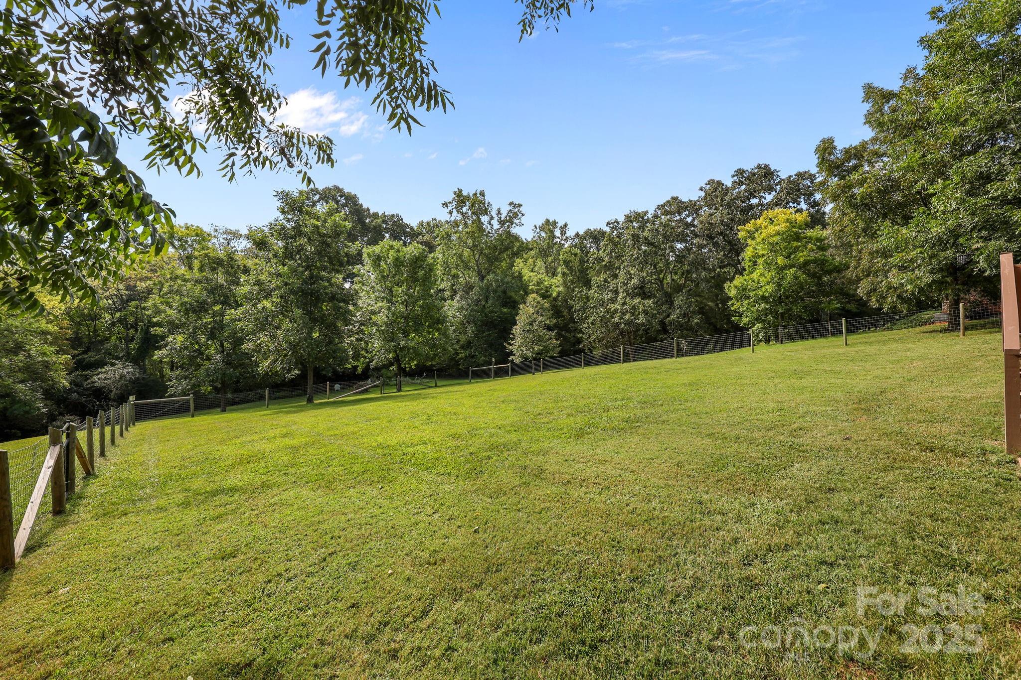 27040 Crepts Branch Road Locust, NC 28097 - Photo 7 of 48 a view of a field with trees in the background