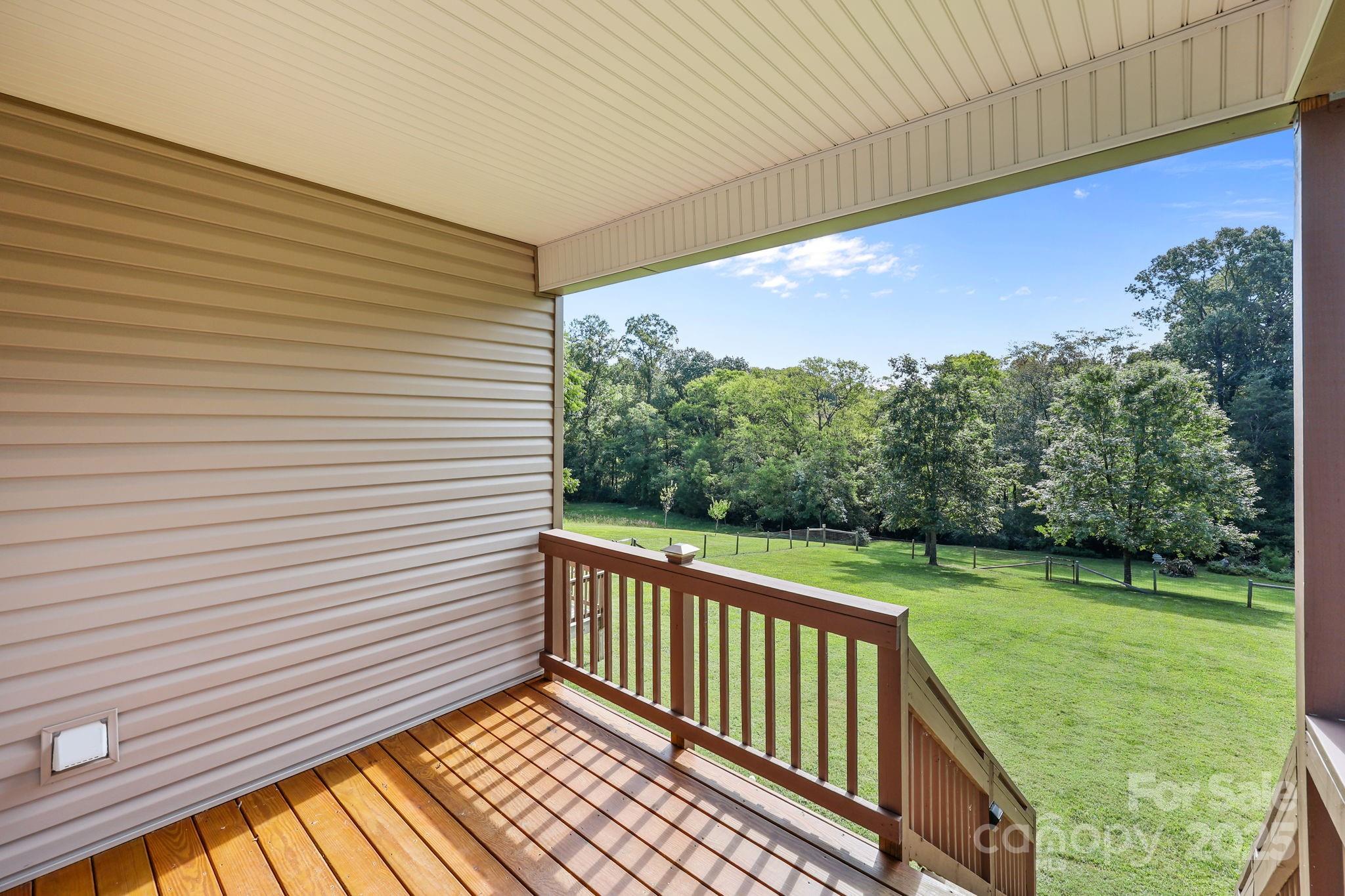 27040 Crepts Branch Road Locust, NC 28097 - Photo 8 of 48 a view of a porch with a yard