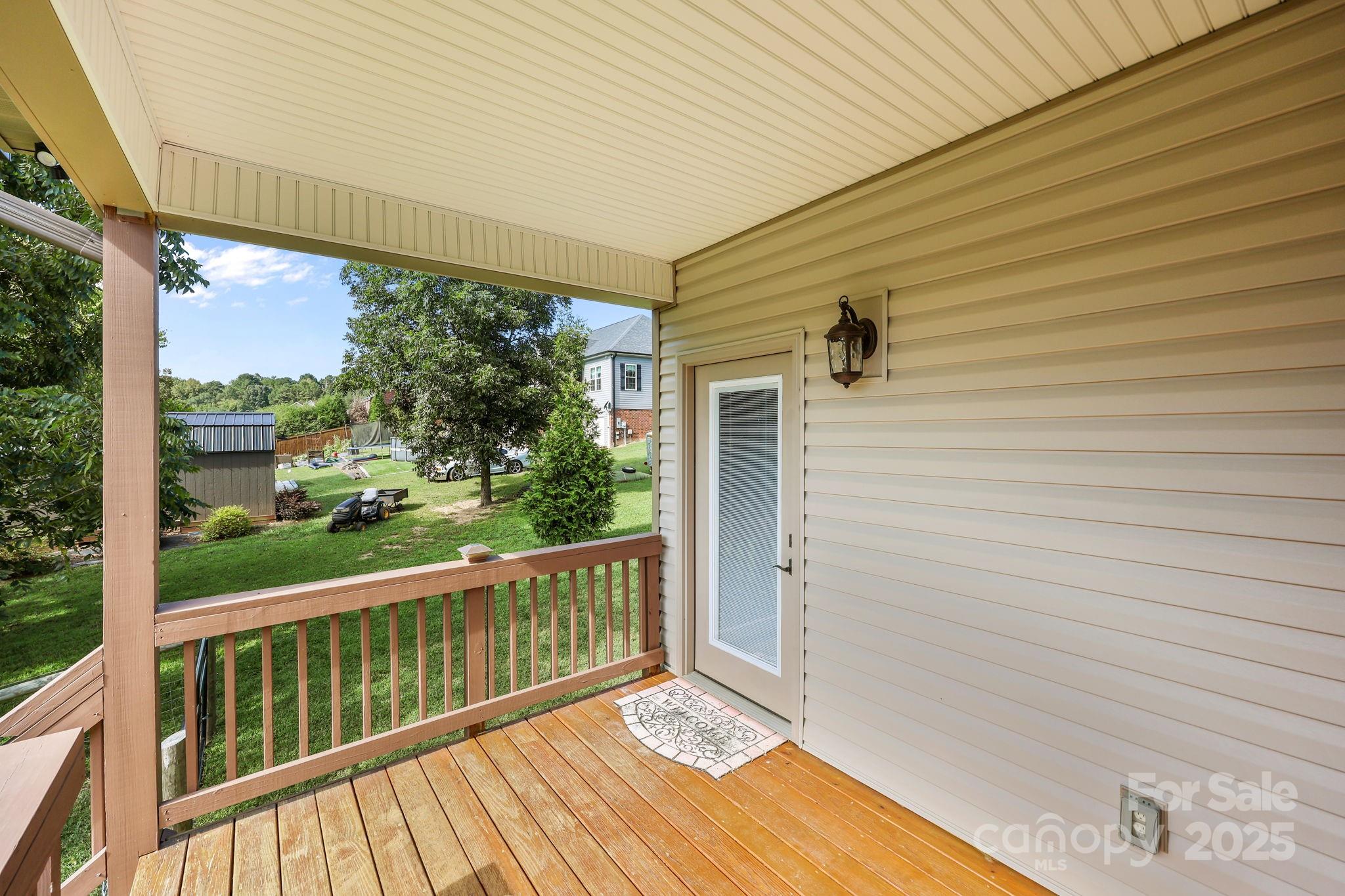 27040 Crepts Branch Road Locust, NC 28097 - Photo 9 of 48 a view of a balcony with wooden floor