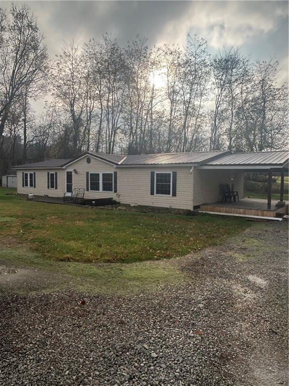 a view of a house with a yard