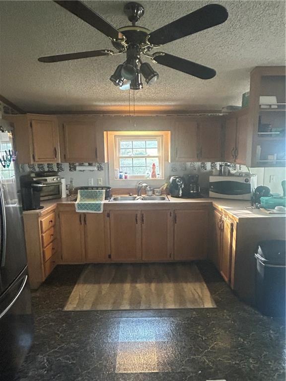 341 Bridgeport Road Mount Pleasant, PA 15666 - Photo 3 of 19 a kitchen with a sink stainless steel appliances cabinets and a large window