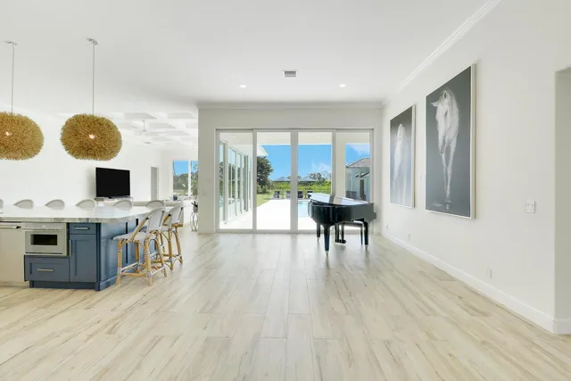 a view of a living room with a fireplace furniture and a chandelier