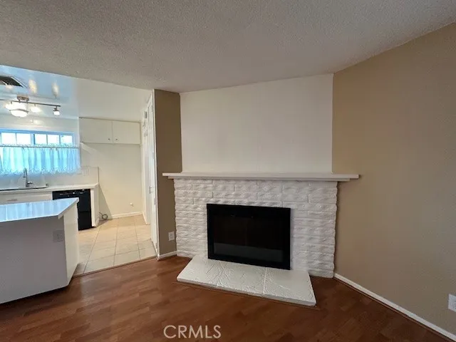 a living room with a fireplace and a fireplace