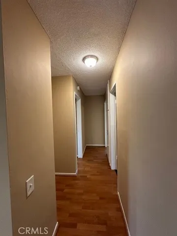 an empty room with wooden floor