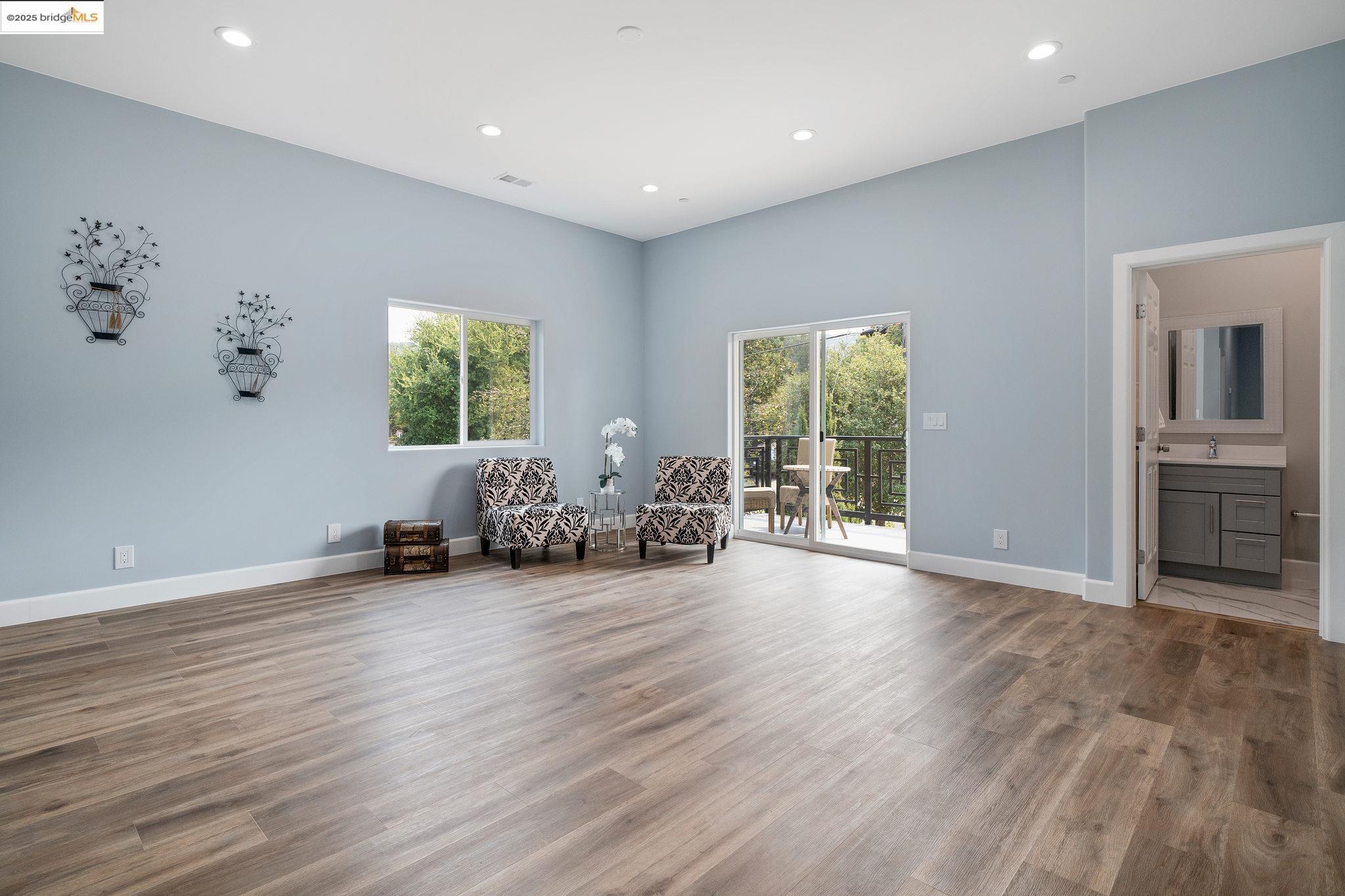 4511 Elmwood Road El Sobrante, CA 94803 - Photo 17 of 42 a view of a livingroom with furniture wooden floor and windows