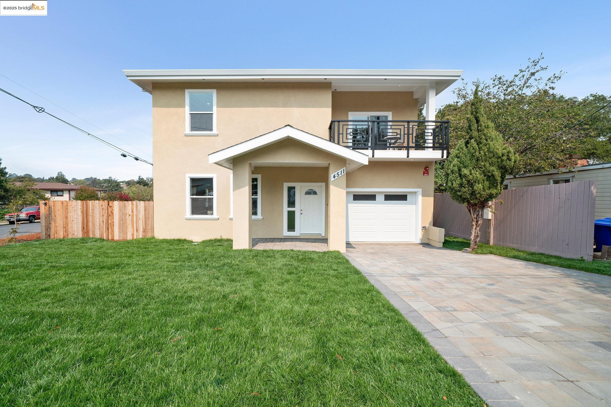 4511 Elmwood Road El Sobrante, CA 94803 - Photo 2 of 42 a front view of a house with yard and green space