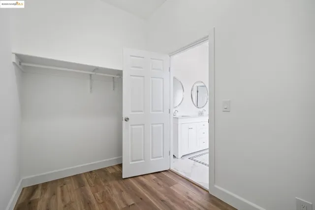 a view of hallway with wooden floor