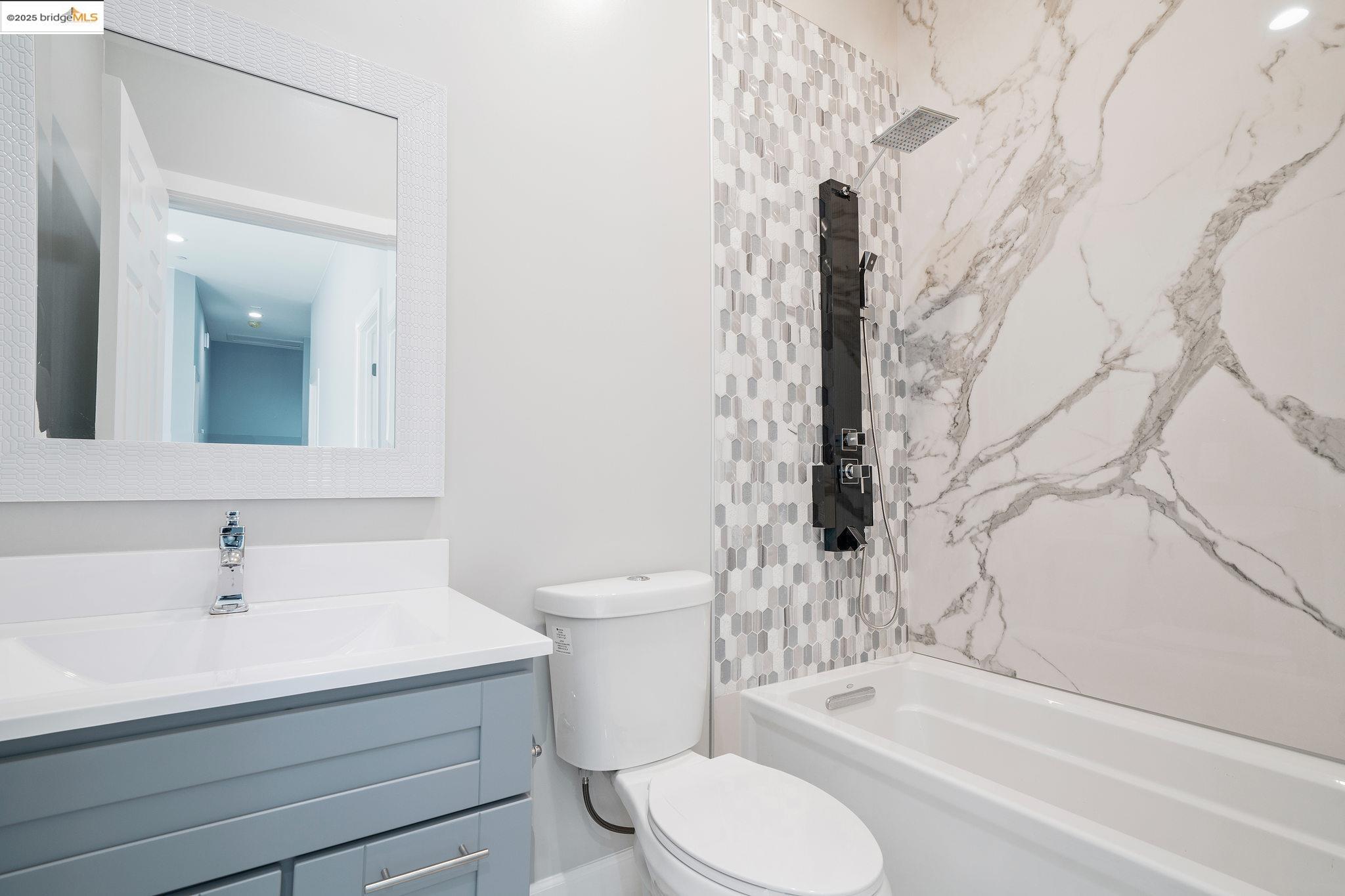 4511 Elmwood Road El Sobrante, CA 94803 - Photo 30 of 42 a bathroom with a sink toilet and shower