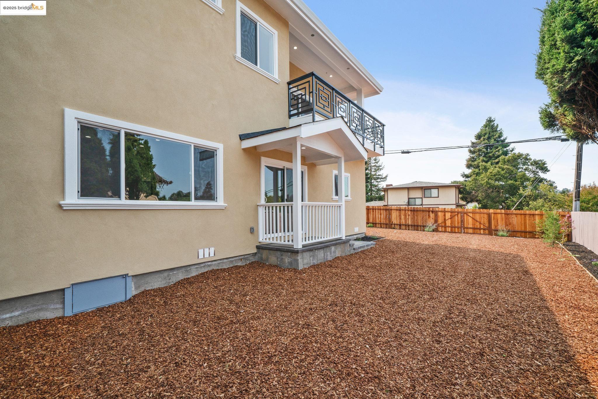 4511 Elmwood Road El Sobrante, CA 94803 - Photo 37 of 42 a view of a house with a backyard