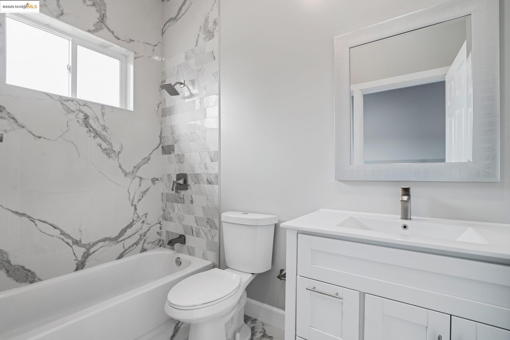 4511 Elmwood Road El Sobrante, CA 94803 - Photo 42 of 42 a bathroom with a sink toilet and shower