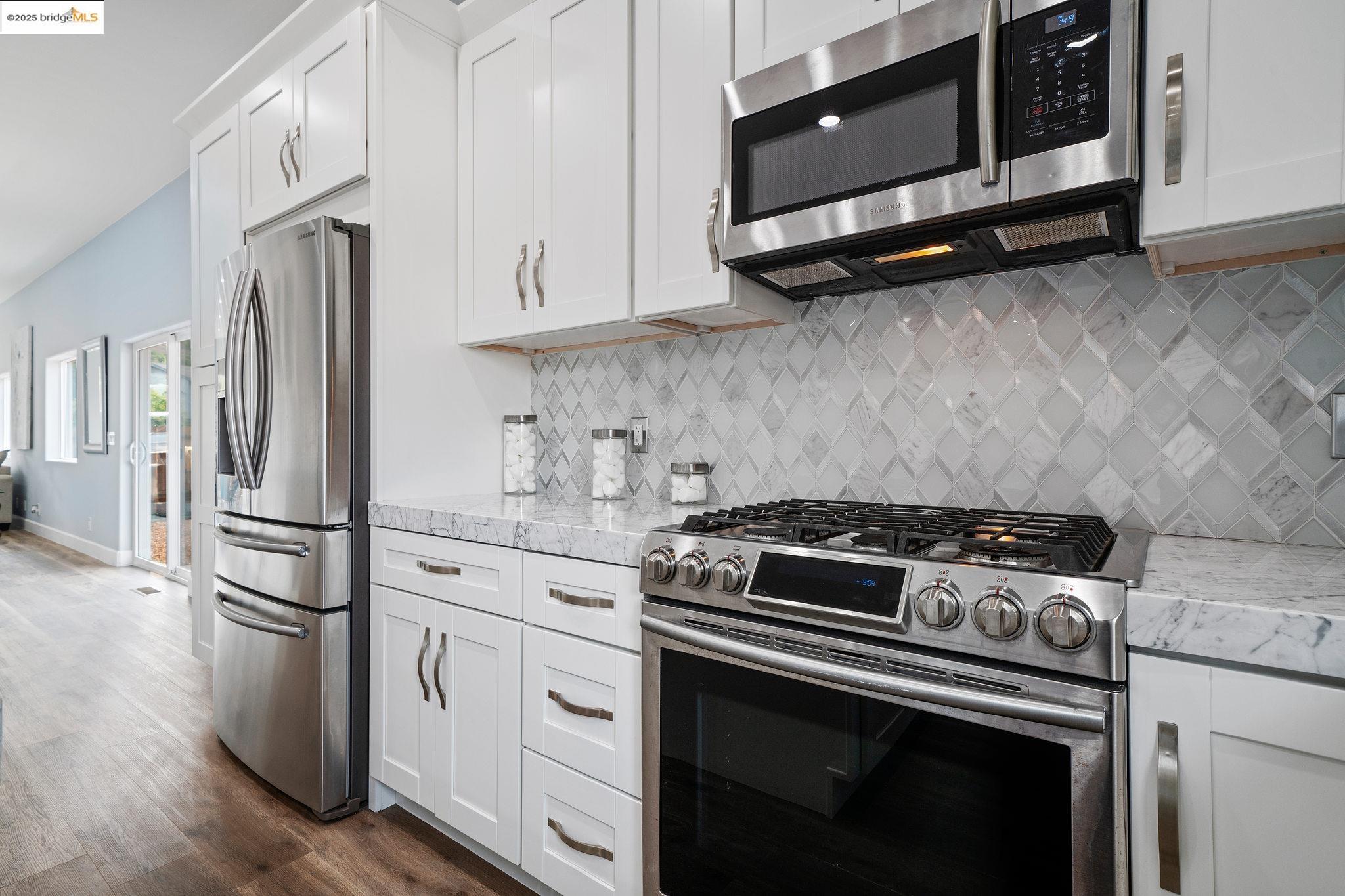 4511 Elmwood Road El Sobrante, CA 94803 - Photo 7 of 42 a kitchen with appliances and cabinets