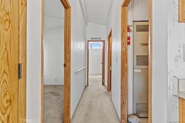 a view of a bathroom from a corridor