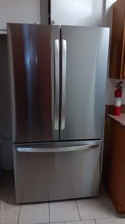 a stove top oven sitting inside of a kitchen