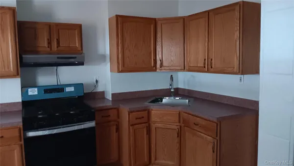 a kitchen with cabinets and appliances