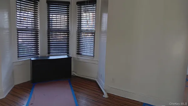 a room with a bed and a mirror