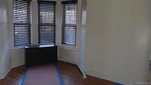 a view of a livingroom with furniture and a window