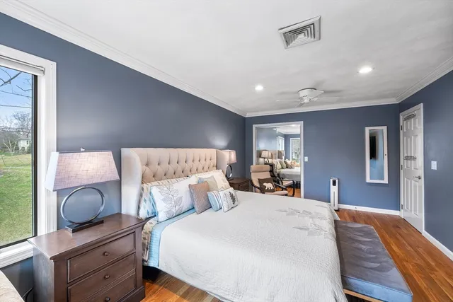 a bed room with a bed and dresser