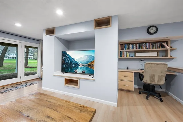 a workspace with furniture and window