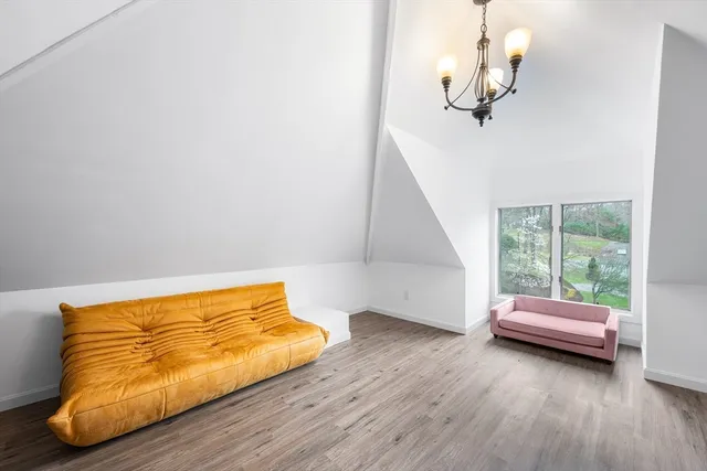 a room with a bed and a window