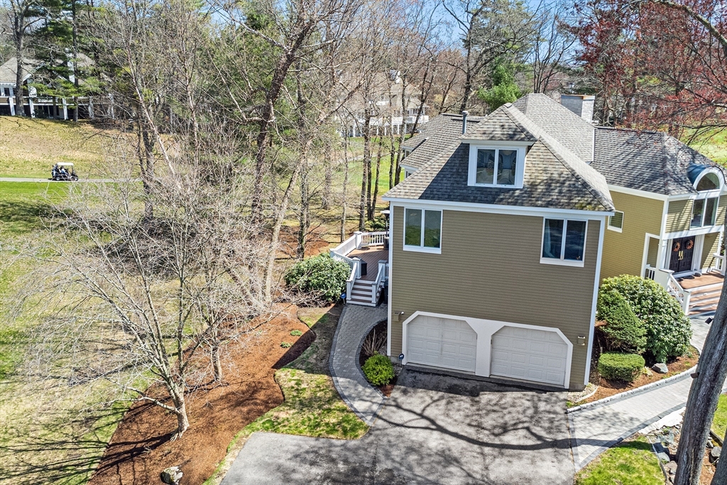 3 Choate Lane Ipswich, MA 01938 - Photo 35 of 39 a view of a patio with table and chairs and wooden fence