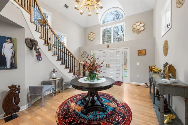 a living room with furniture and a dining table