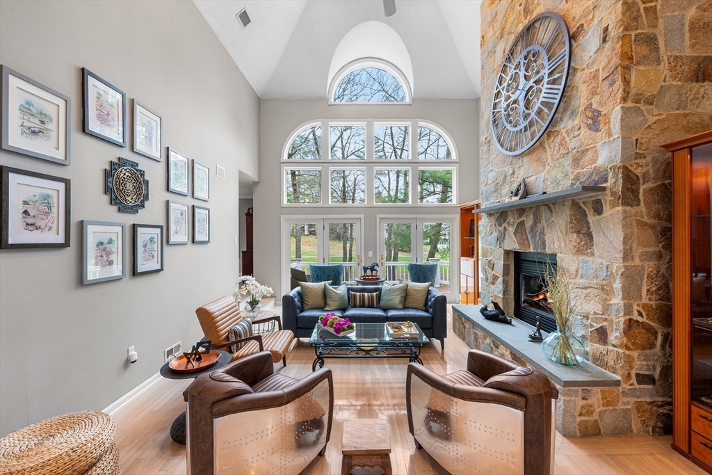3 Choate Lane Ipswich, MA 01938 - Photo 7 of 39 a living room with furniture a fireplace and a clock