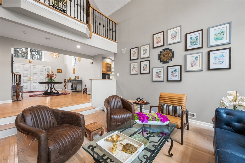 3 Choate Lane Ipswich, MA 01938 - Photo 8 of 39 a living room with furniture and paintings on the wall