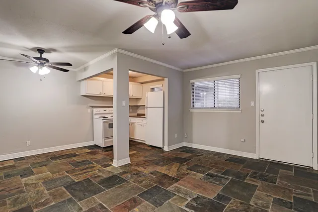 a very nice looking room with a ceiling fan