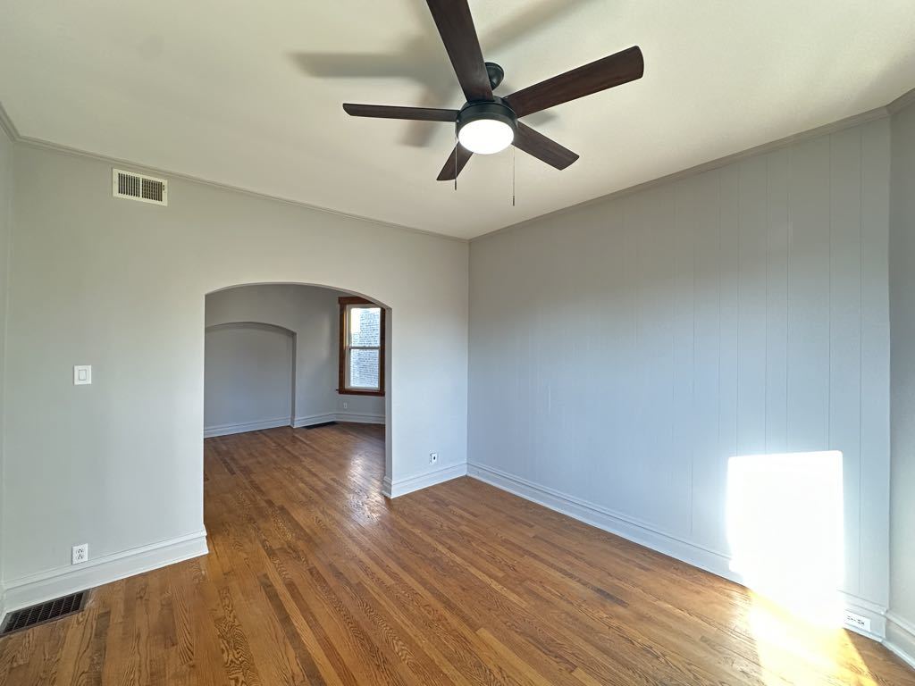 4020 West Cornelia Avenue, Unit 2 Chicago, IL 60641 - Photo 12 of 20 wooden floor in an empty room with a window