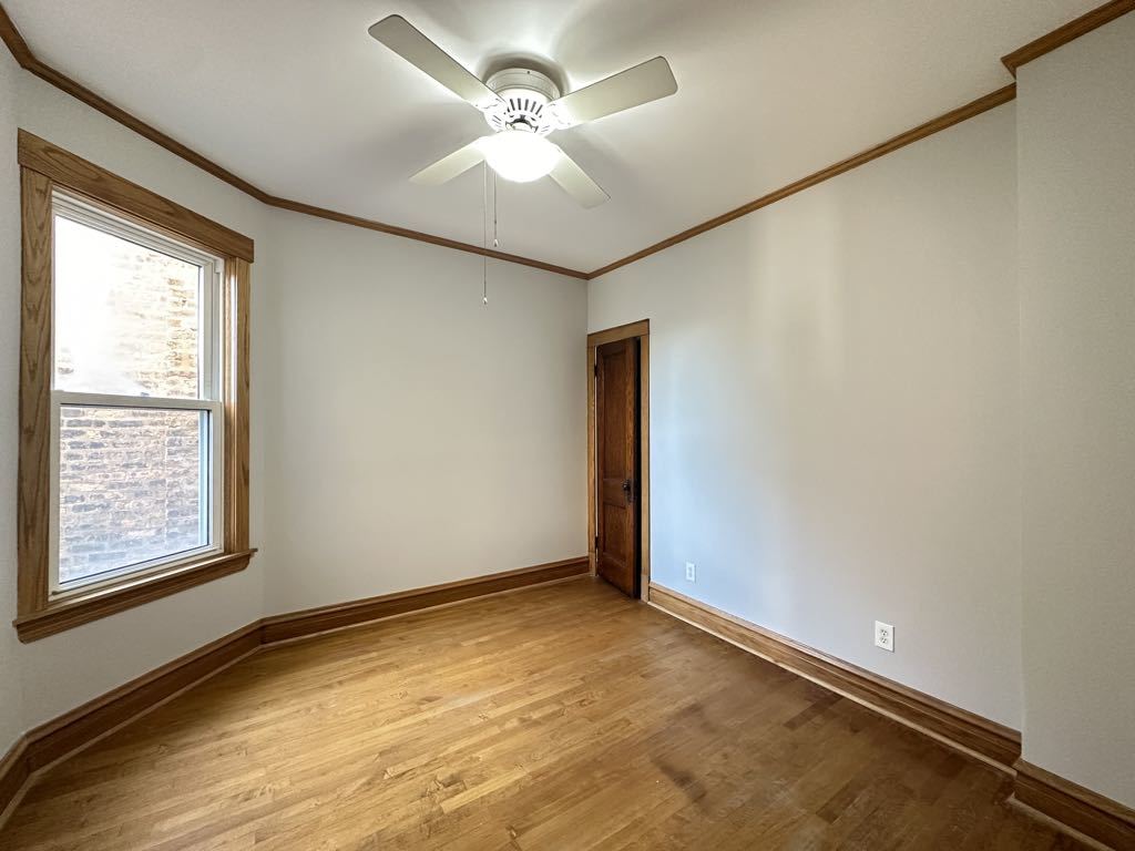 4020 West Cornelia Avenue, Unit 2 Chicago, IL 60641 - Photo 15 of 20 a view of an empty room with a window