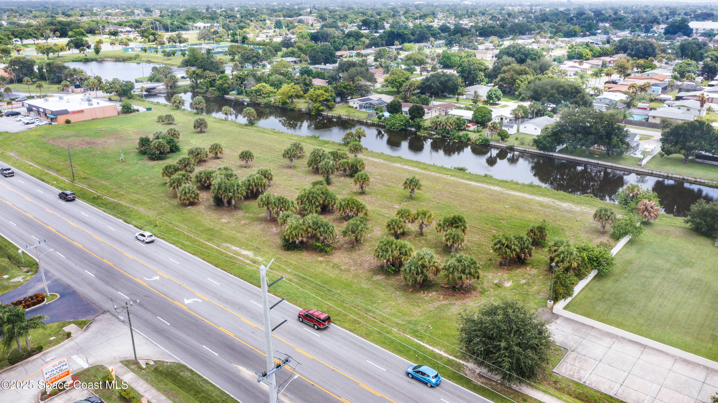 551 North Wickham Road Melbourne, FL 32935 - Photo 1 of 10 a view of a city from a balcony