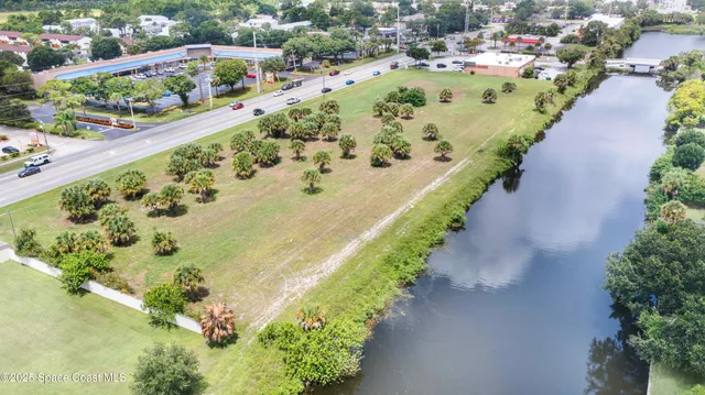 an aerial view of a residential houses with outdoor space